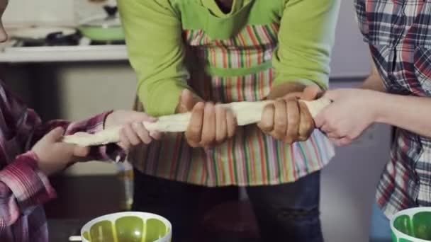 Father and his daughters knead the dough with their hands. - Filmati, video