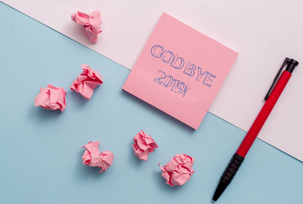 Conceptual hand writing showing God Bye 2019. Business photo showcasing express good wishes when parting or at the end of last year Stationary placed sideways on top of the softhued backdrop. - Photo, Image