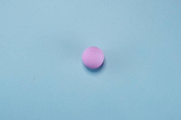 Pink ball lie on pastel blue background. Minimal summer concept. - Fotografie, Obrázek