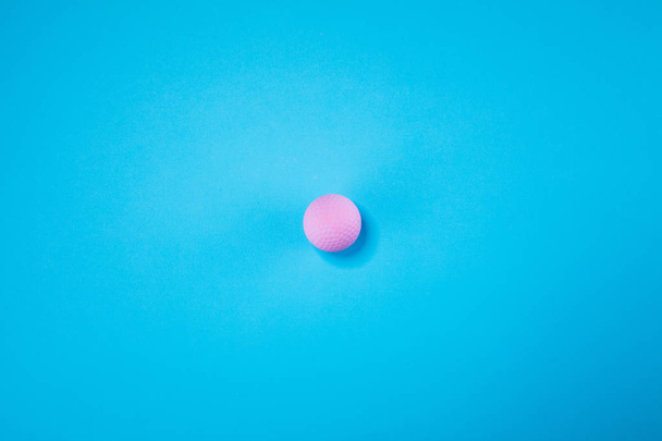 Pink ball lie on pastel blue background. Minimal summer concept. - Photo, Image