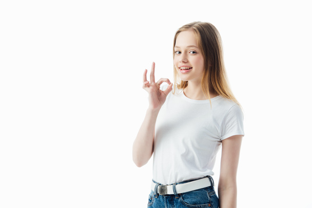 happy teenage girl showing ok sign isolated on white - Фото, изображение