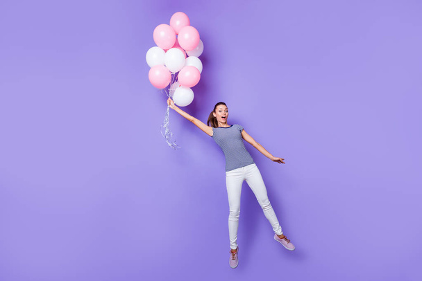 Full length body size view portrait of her she nice attractive lovely girlish cheerful cheery girl having fun with helium balls isolated over violet purple vivid shine bright background - Photo, image