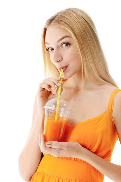 Beautiful young woman with fresh juice on white background - Photo, Image
