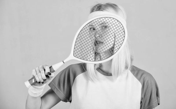 Athlete hold tennis racket in hand. Tennis club concept. Tennis sport and entertainment. Active leisure and hobby. Girl adorable blonde play tennis. Start play game. Sport for maintaining health - Zdjęcie, obraz