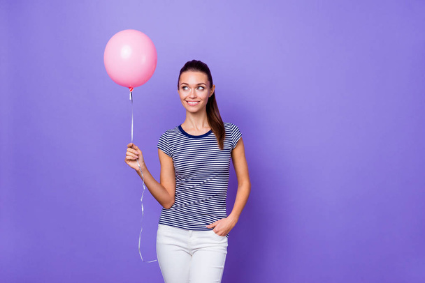 Portrait of her she nice-looking attractive lovely charming cute winsome cheerful cheery feminine girl holding in hand pink helium ball isolated over violet purple vivid shine bright background - Фото, зображення