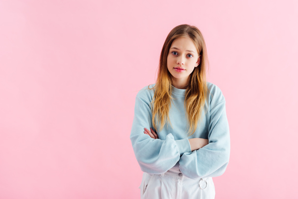 offended teenage girl with crossed arms isolated on pink - Fotoğraf, Görsel