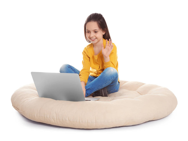 Little girl using video chat on laptop, white background - Foto, Imagem