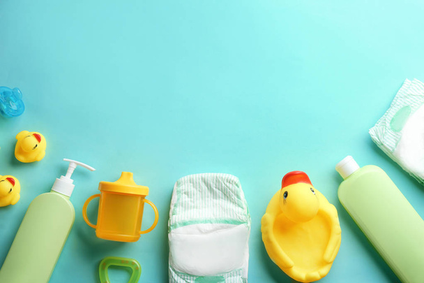 Flat lay composition with baby accessories and space for text on color background - Foto, afbeelding