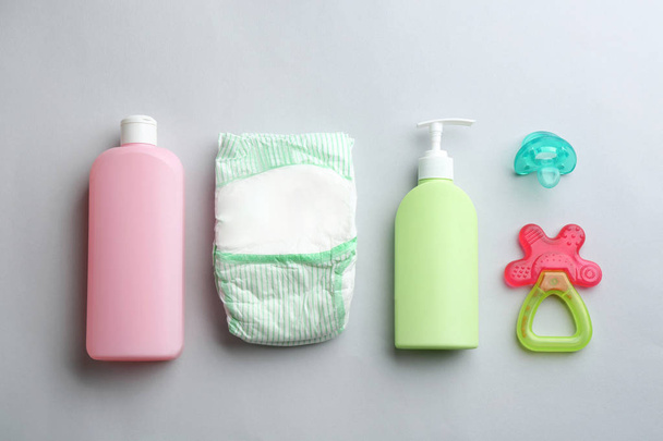 Flat lay composition with baby accessories on light background - Foto, afbeelding