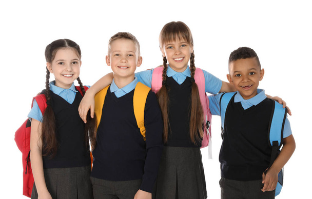 Πορτρέτο των χαριτωμένα παιδιά σε σχολική στολή σε λευκό φόντο - Φωτογραφία, εικόνα