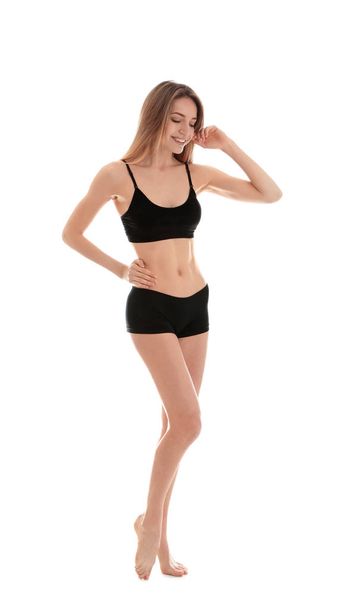 Young slim woman on white background. Perfect body - Foto, afbeelding