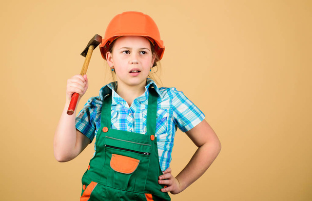 Kid builder girl. Build your future yourself. Initiative child girl hard hat helmet builder worker. Tools to improve yourself. Child care development. Builder engineer architect. Future profession - Photo, Image