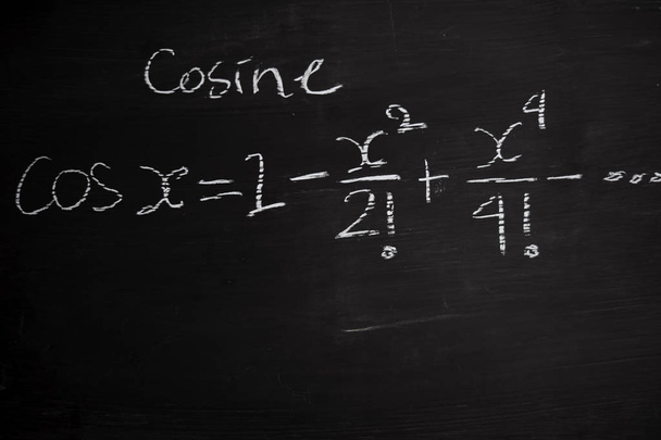 Close up math formulas written on a blackboard. Education concept - Photo, Image