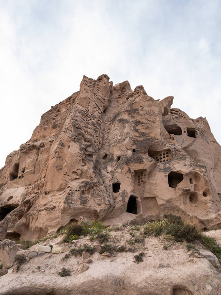 Uchisar Castle in Cappadocia Region of Turkey. - Фото, изображение