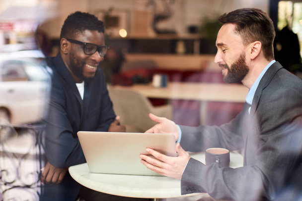 Two businessmen at cafe - Фото, изображение