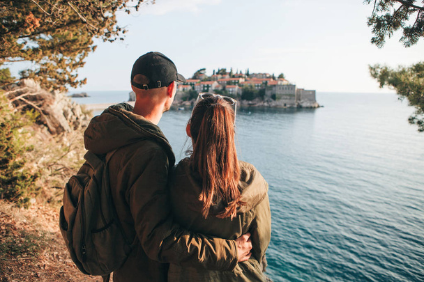 Couple looking at Sveti Stefan - Photo, Image