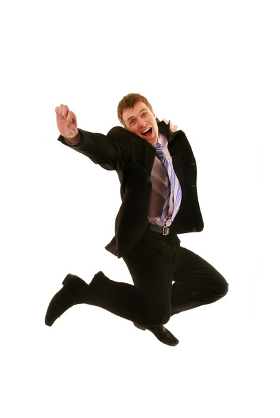 Jumping young businessman isolated on a white background - Photo, image