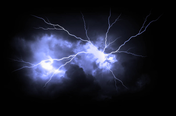 Lightning strike on the dark cloudy sky. - Фото, изображение