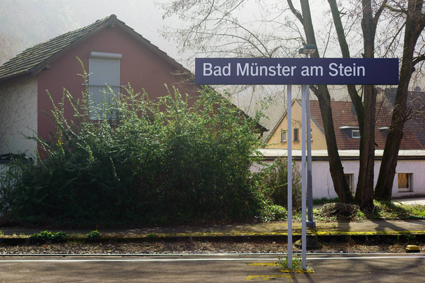 Stop Bad Mnster am Stein / The stop Bad Mnster am Stein with a place name sign on the rails - Fotoğraf, Görsel