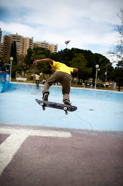 Valencia, Spain - March 24, 2012: Young latino doing stunts with - Fotó, kép
