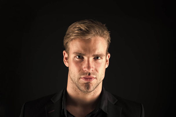 Confidence and masculinity. Man well groomed with bristle and hairstyle black background. Macho confident strict face close up. Guy handsome attractive formal wear. Guy confident in his appearance - Fotoğraf, Görsel