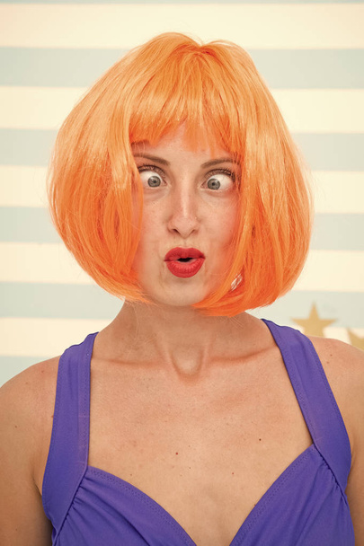 crazy girl with orange hair. crazy emotions on face of girl. feelings and emotions concept. crazy eyes of cosplay girl. going crazy. woman with funny eyes strabismus. - Foto, Imagen