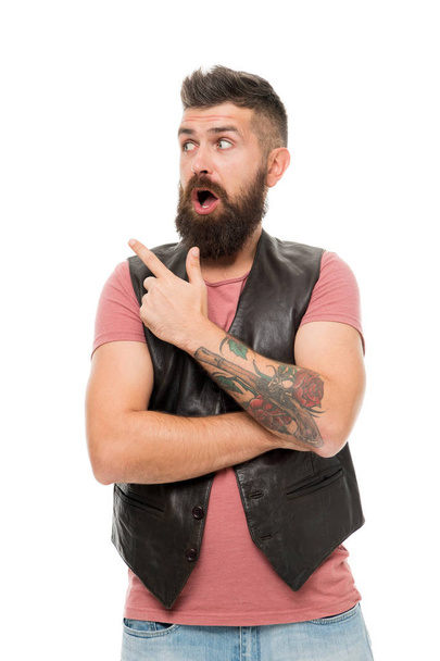 Guy pointing with index finger. Barbershop and beard grooming. Styling beard and moustache. Fashion trend beard grooming. Check this out. Hipster with beard brutal guy. Product recommendation concept - 写真・画像
