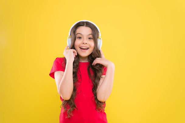 Excellent audio sound quality. Child teen enjoy music playing in earphones. Little girl enjoying favorite music. Catch the rhythm. Kid listening music headphones. Entertainment and fun. Top songs - 写真・画像
