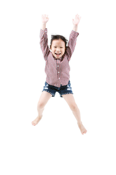 Portrait of happy little Asian child jumping isolated on white  - Foto, Imagen