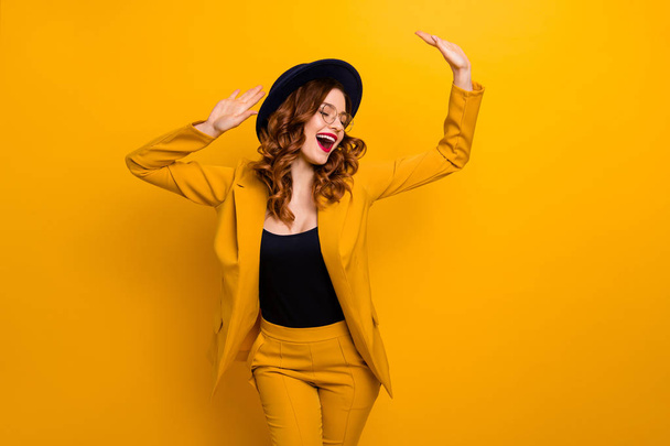 Portrait of her she nice charming cute attractive lovely fascinating fashionable chic cheerful wavy-haired lady wearing yellow suit jacket isolated on bright vivid shine orange background - Zdjęcie, obraz