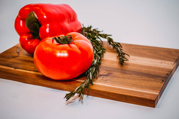 bell peppers, rosemary, tomatoes, ingredients for cooking on wooden rustic background, place for text.raw organic vegetables, fresh ingredients for healthily cooking.Vegetarian, healthy food - Foto, Imagem