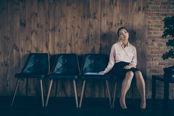 Portrait of nice attractive elegant stylish bored tired lady qualified specialist sitting on chair waiting meeting recruiter director at modern industrial loft interior style work place station - Fotoğraf, Görsel
