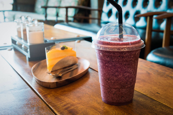 Healthy smoothies cup for weight loss, some healthy food, sweet breakfast on the wooden table in the bakery cafe - Photo, Image