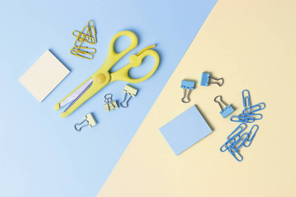 Stationery on blue and yellow background. Back to school concept. - Fotoğraf, Görsel
