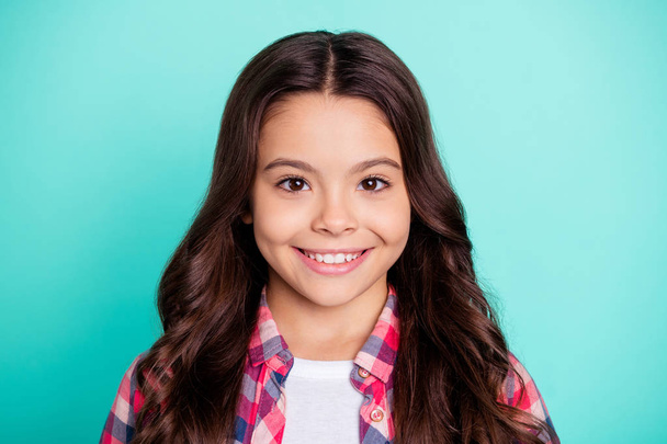 Close-up portrait of her she nice attractive lovely winsome sweet cute cheerful cheery wavy-haired pre-teen girl wearing checked shirt isolated on bright vivid shine blue background - Φωτογραφία, εικόνα