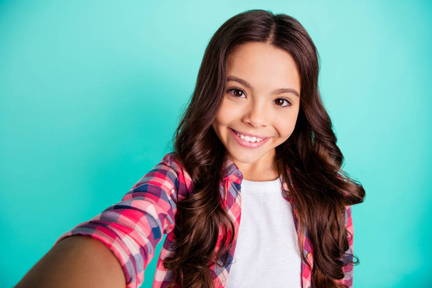 Self-portrait of her she nice attractive lovely sweet charming cute cheerful cheery wavy-haired pre-teen girl wearing checked shirt isolated over bright vivid shine green blue turquoise background - Fotografie, Obrázek