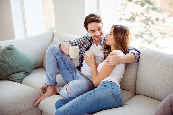 Portrait of her she his he two person nice-looking attractive lovely charming sweet lovable cheerful guy lady sitting on divan spending free time in light white style interior living room house - Valokuva, kuva