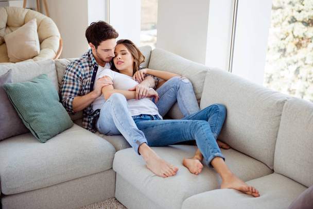 Two person his he her she nice attractive lovely charming lovable sweet guy lady lying on cosy divan sleeping spending time in light white style interior living room hotel house indoors - 写真・画像