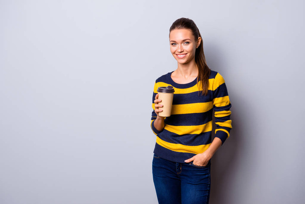 Portrait of her she nice-looking charming lovely shine lovable attractive cheerful cheery girl having fun time drinking beverage isolated over gray pastel background - Foto, afbeelding