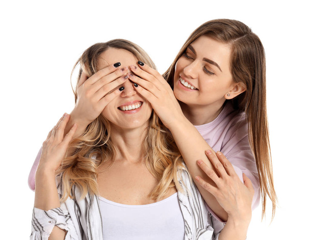 Portrait of happy mother and daughter on white background - Photo, image