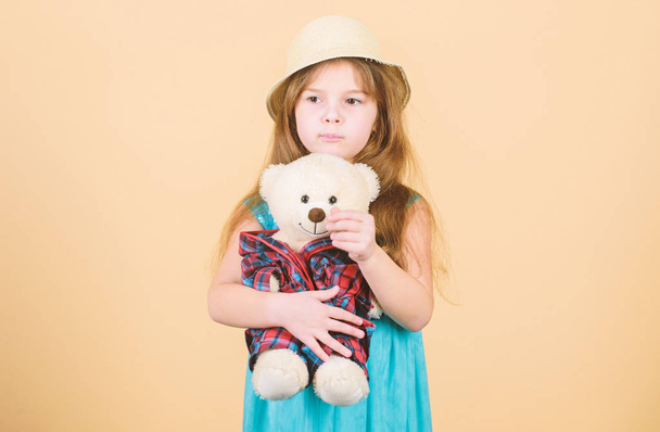 Its my toy. Small child cuddling teddy bear toy. Adorable girl child with cute stuffed animal doll. Little girl holding soft toy. Toy is used in play - Fotografie, Obrázek