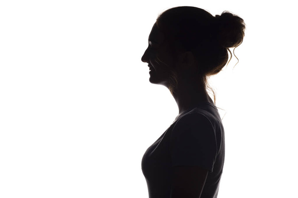 silhouet van meisje op een witte geïsoleerde achtergrond - Foto, afbeelding