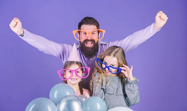 Hurray. Happy family celebrating birthday party. Family party. Family of father and daughters wearing party goggles. Father and girl children enjoying party time. Having a family celebration - Foto, Imagem