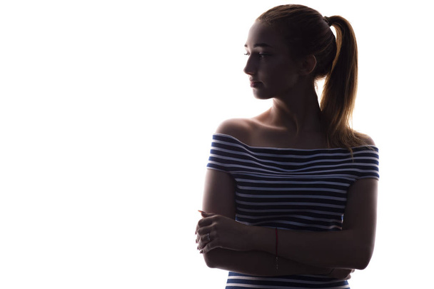 silhouette di ragazza adolescente su uno sfondo bianco isolato, profilo viso donna
 - Foto, immagini