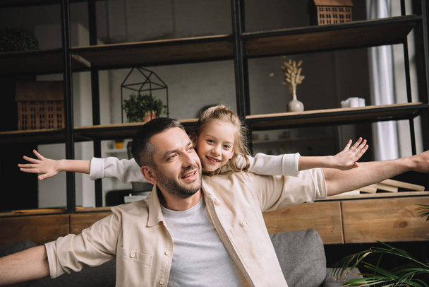happy father with adorable daughter having fun together at home - Photo, Image