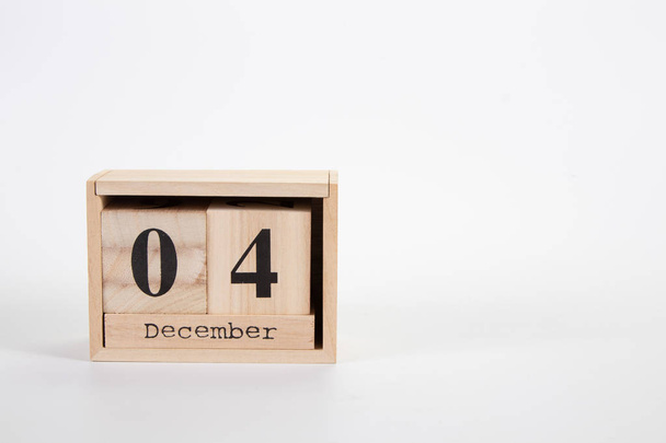 Wooden calendar December 04 on a white background  - Foto, Bild