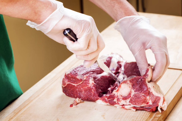 Separation of a raw mutton meat with rib  - Photo, Image