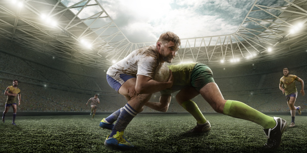 Rugby players fight for the ball on professional rugby stadium - Photo, Image