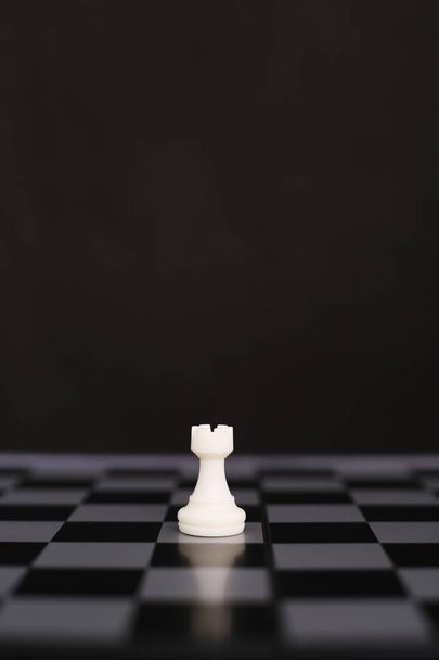 Portrait of white chess pawn on the chessboard. isolated on the black background. - Φωτογραφία, εικόνα