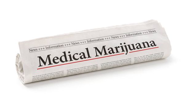 Rolled newspaper with the headline Medical marijuana - Photo, Image